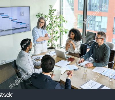 stock-photo-senior-female-ceo-and-multicultural-business-people-discussing-company-presentation-at-boardroom-2021639270